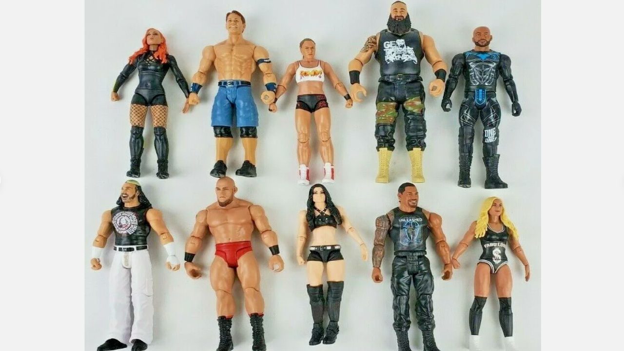 Set of twelve Mattel WWE action figures posed upright, featuring both male and female wrestling superstars in signature gear