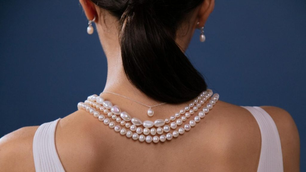 Woman Wearing White Pearl Necklace