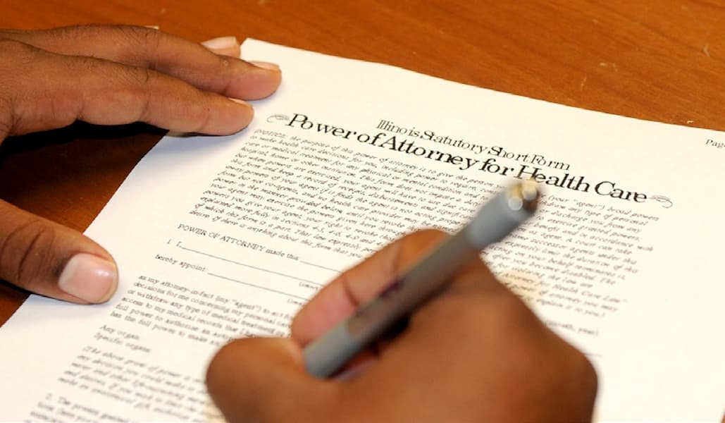 Power of Attorney document, formal legal paper, black printed text, signature lines, notary seal, official formatting, white or cream paper