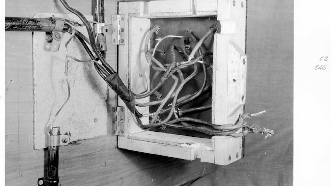 old aluminum wiring, dull gray color, frayed ends, oxidation spots, brittle insulation, exposed wires, tangled layout
