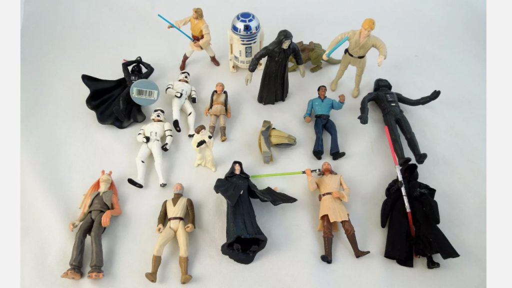 Assorted vintage Star Wars action figures from the 1980s displayed on a flat surface