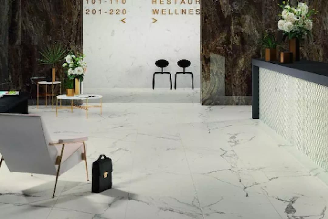 Terrazzo flooring, polished surface, multicolored stone chips, speckled pattern, smooth finish, durable composite material, decorative interior design element.