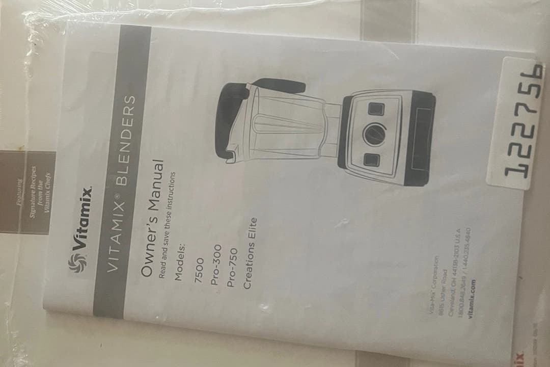 Blender user manual, printed black text, white paper, diagrams and illustrations, instructions for use and care, official branding, product specifications