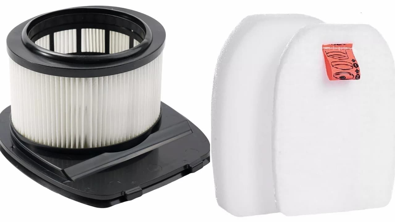 vacuum cleaner filter, cylindrical shape, pleated material, plastic frame, dust buildup visible, detached from vacuum unit