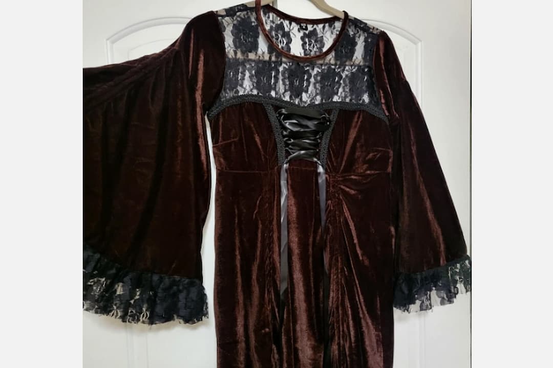Velvet clothing, soft plush texture, rich deep colors, subtle sheen, draped fabric, elegant and luxurious appearance, tailored or flowing design, displayed on hangers or worn stylishly