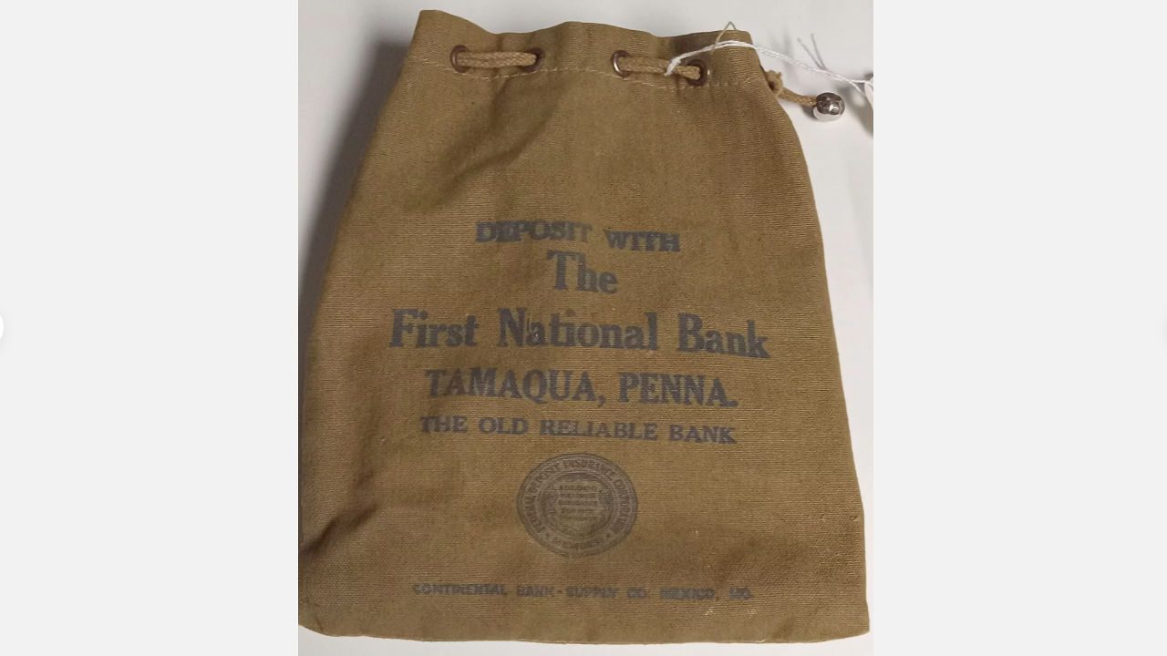 vintage canvas bank deposit bag, printed with “First National Bank Tamaqua, Penna. The Old Reliable Bank,” drawstring closure, aged brown fabric