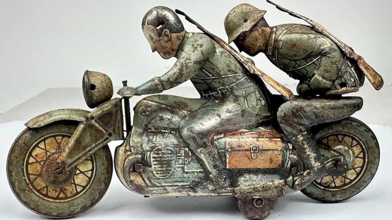 German military uniform, gray-green wool fabric, insignia and medals, peaked cap, leather boots, belt, historical attire