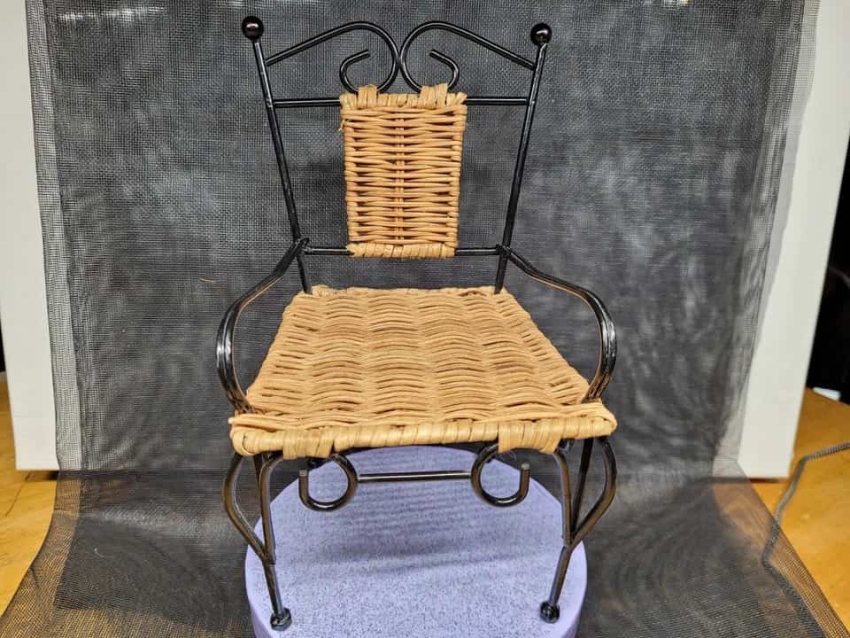 Wicker and rattan furniture, woven natural fibers, light brown finish, curved armrests, cushioned seating, rustic aesthetic, tropical design style, indoor or patio use