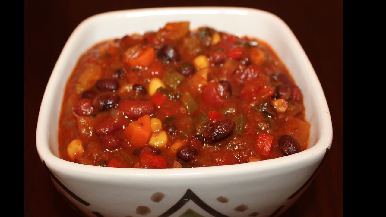 Close-up of hearty bean chili in a white bowl