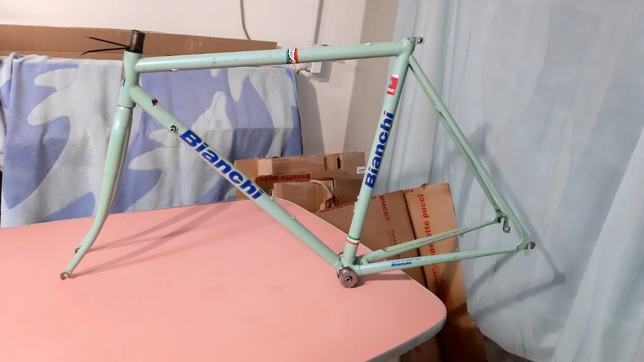 bicycle frame, metal tubing, triangular geometry, lightweight design, welded joints, matte or glossy finish, no wheels attached