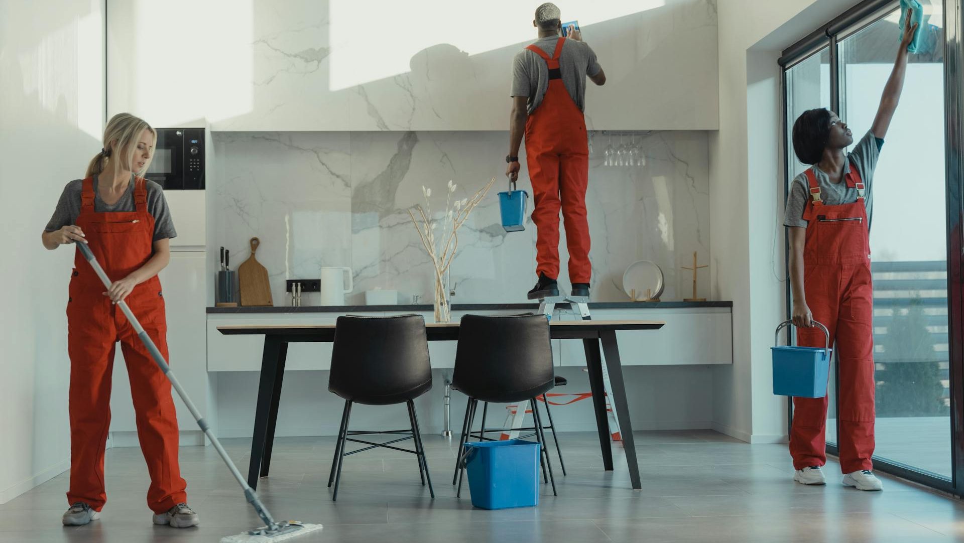 Group of People Cleaning a Dining room