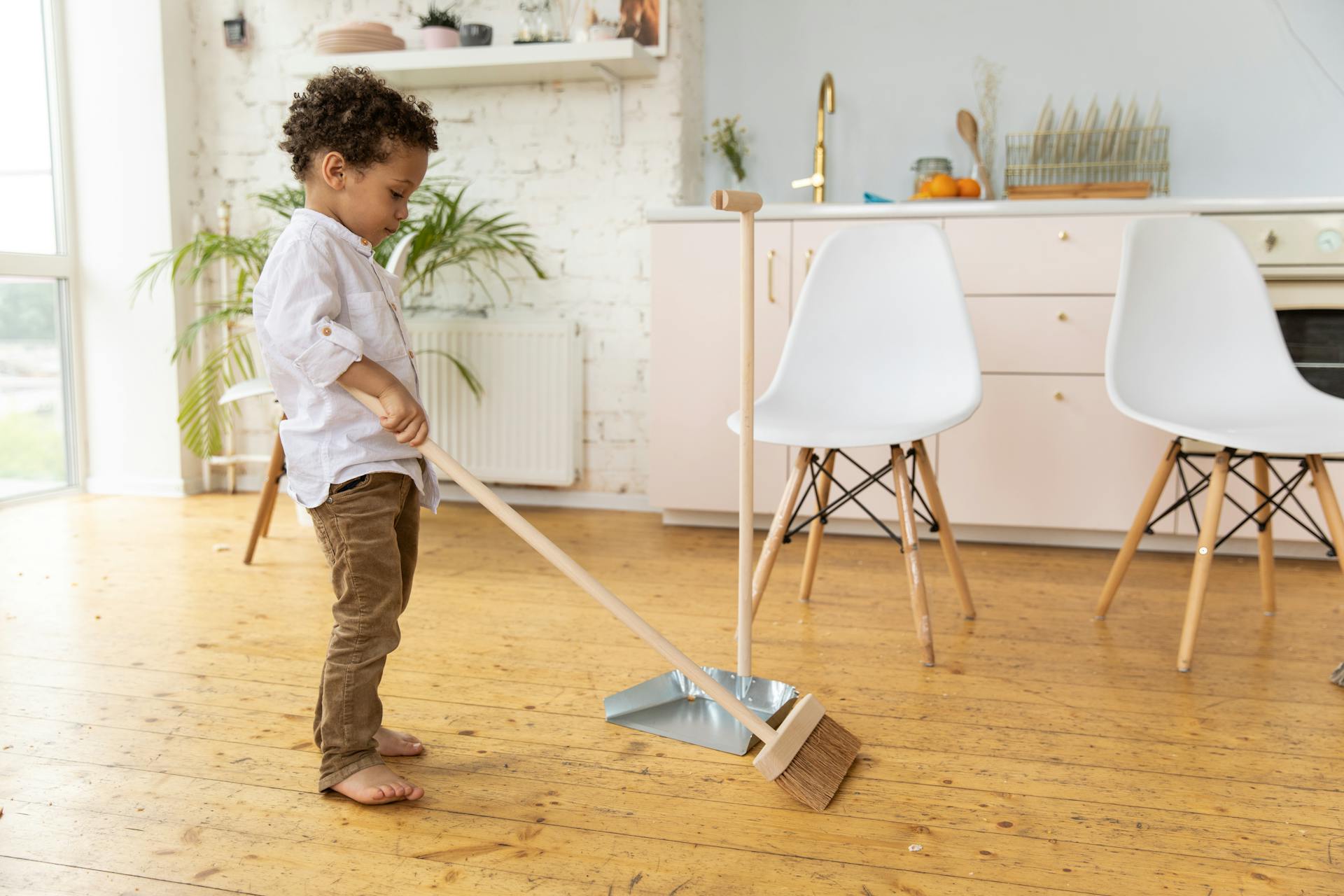 Little Kid Sweeping Floor