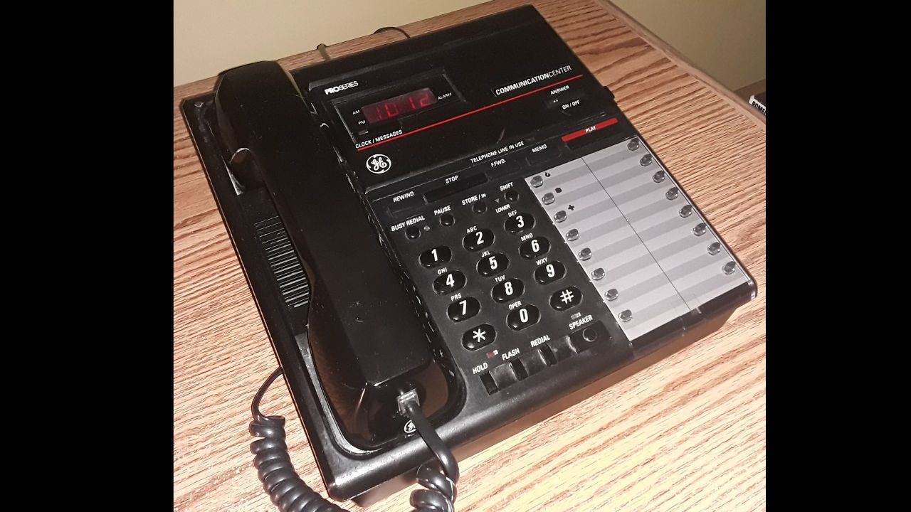 landline answering macine, A General Electric corded telephone with a built-in microcassette answering machine