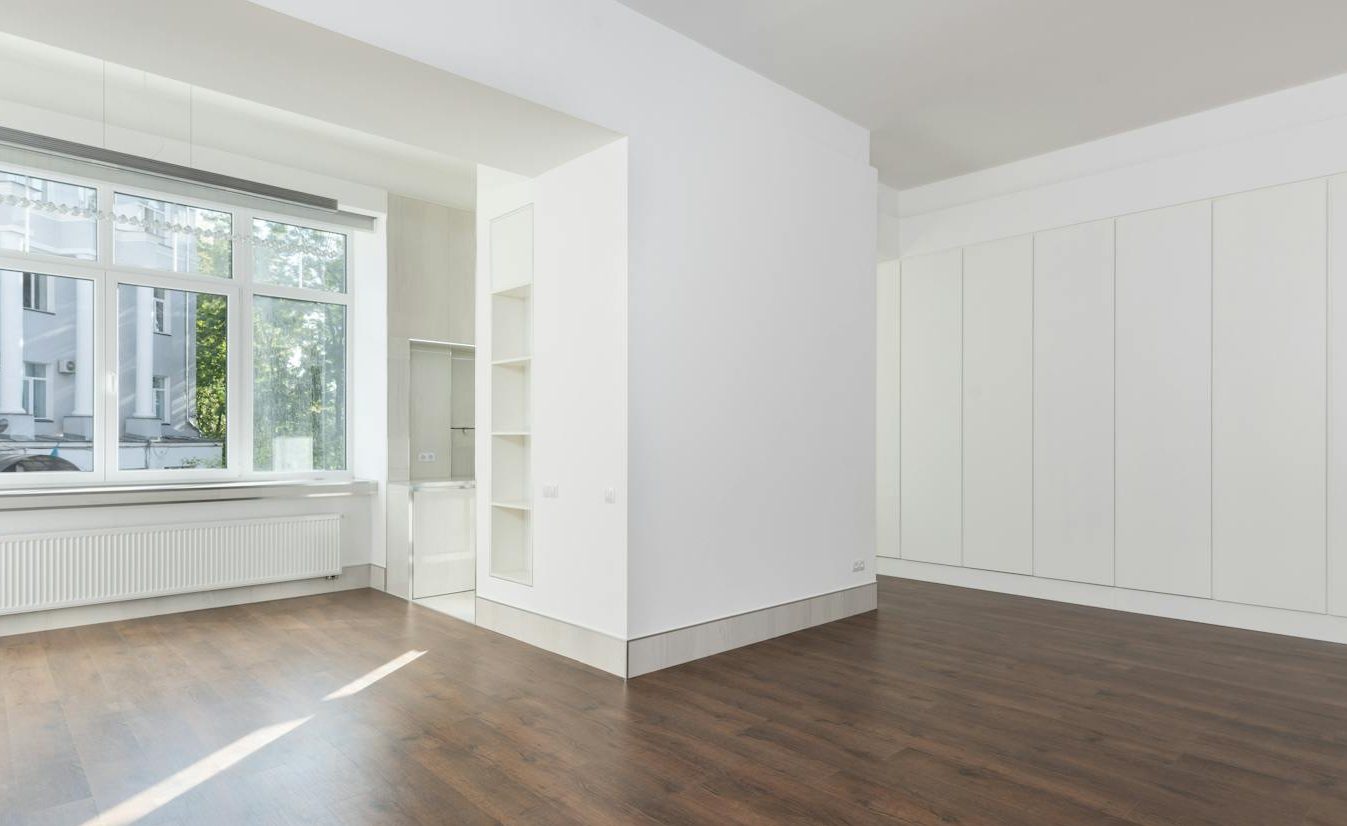 White Room with Wooden Flooring shelves