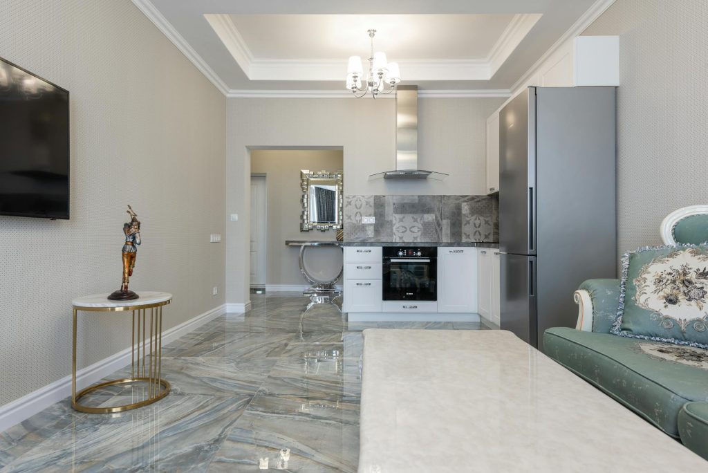 Modern room and kitchen interior with furniture at home