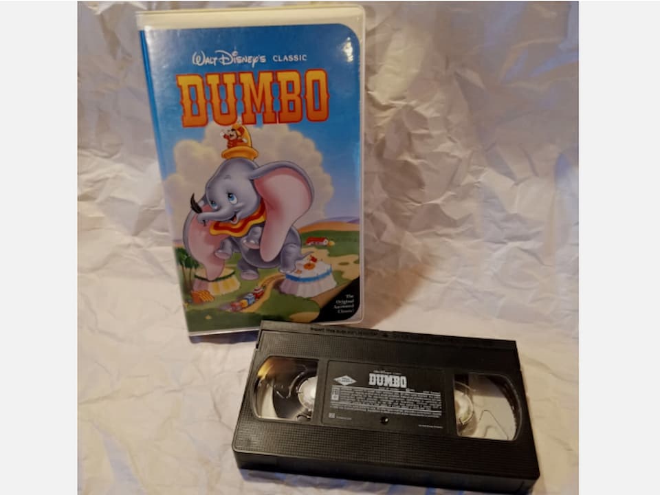 Dumbo Black Diamond Edition VHS, clamshell case, Dumbo flying with big ears, circus background, bold title at the top