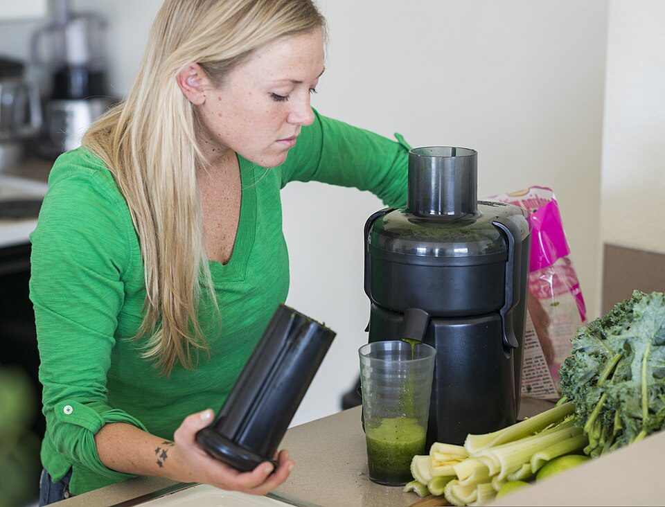 U.S. Air Force Senior Airman Megan Stanton, a medic with the 366th Medical Operations Squadron, juices fruits and vegetables at her home in Mountain Home, Idaho, July 17, 2013. Stanton made juicing a daily routine due to the nutrient-dense quality that supported her healthy diet.