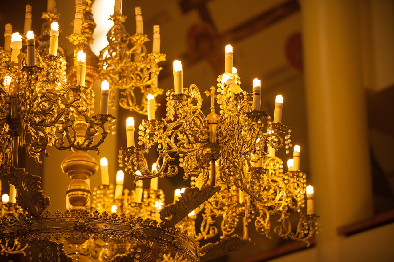 A Gold Chandelier with Lights On