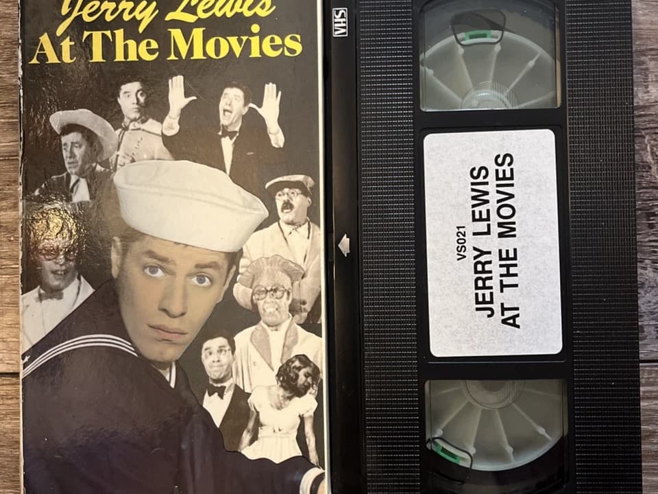 The Day the Clown Cried VHS (fan copy or bootleg), minimal or custom artwork, somber clown face, unofficial packaging, rare or unreleased film label