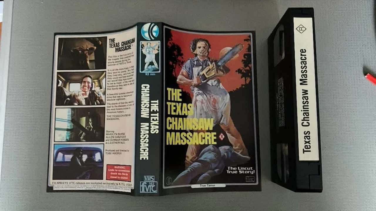 The Texas Chainsaw Massacre 1982 Media Home Entertainment VHS, dark gritty cover with Leatherface holding a chainsaw, worn clamshell case, retro horror aesthetic
