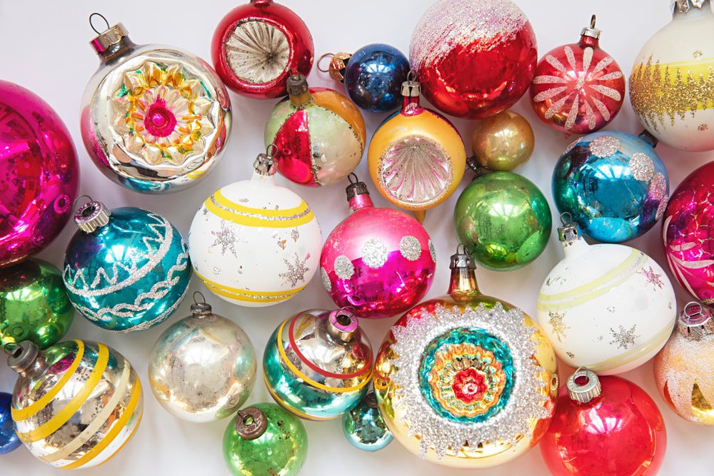 layout of vintage christmas baubles on a plain white background