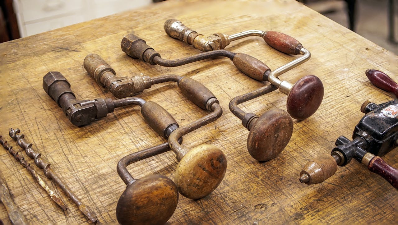 Vintage Rusty Tools on a Wooden Table