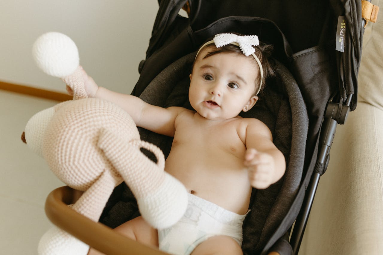 Baby Girl Lying Down in Stroller