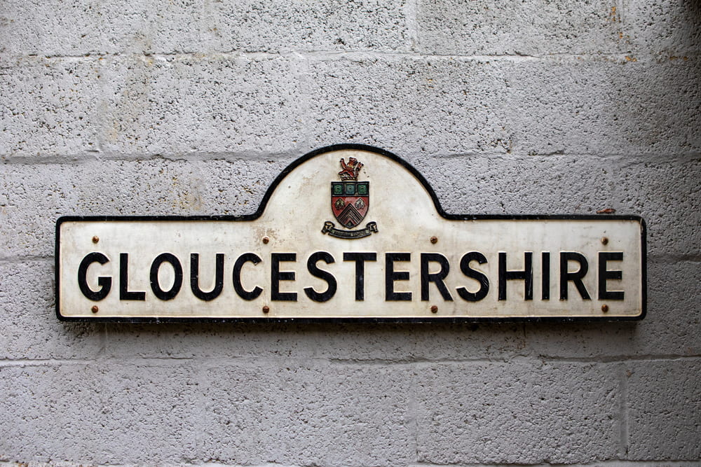 An old Gloucestershire sign. Gloucestershire is a county in the United Kingdom.