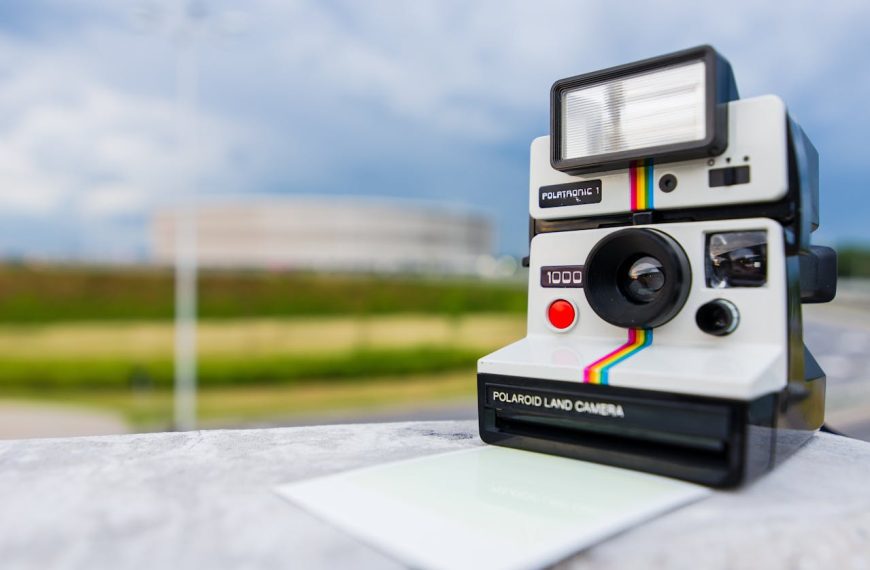 Tilt Shift Photography of Polaroid Land Camera on White Table
