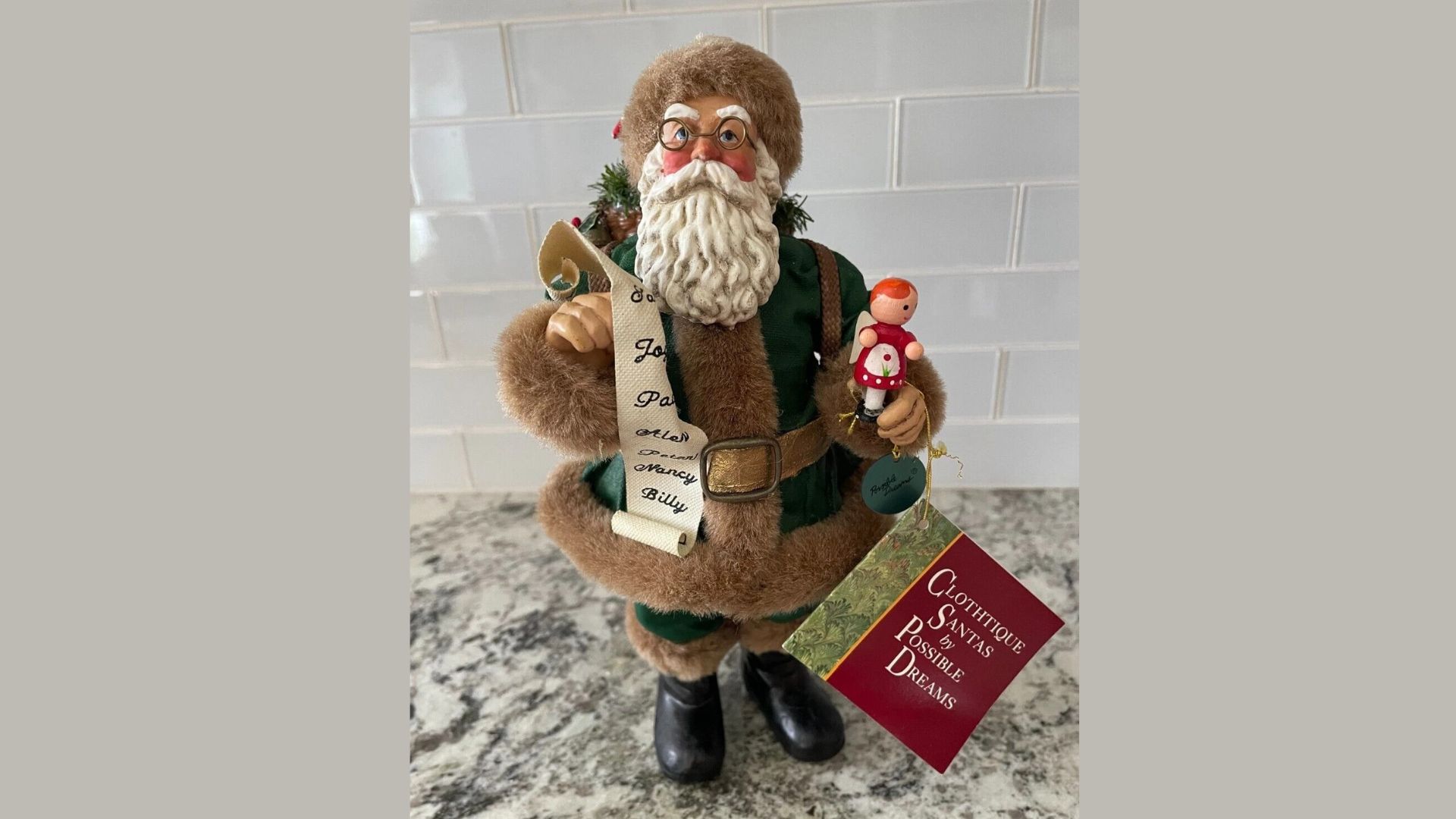 Possible Dreams Clothtique Santa with Bag of Gifts Holding Toy Angel Figurine
