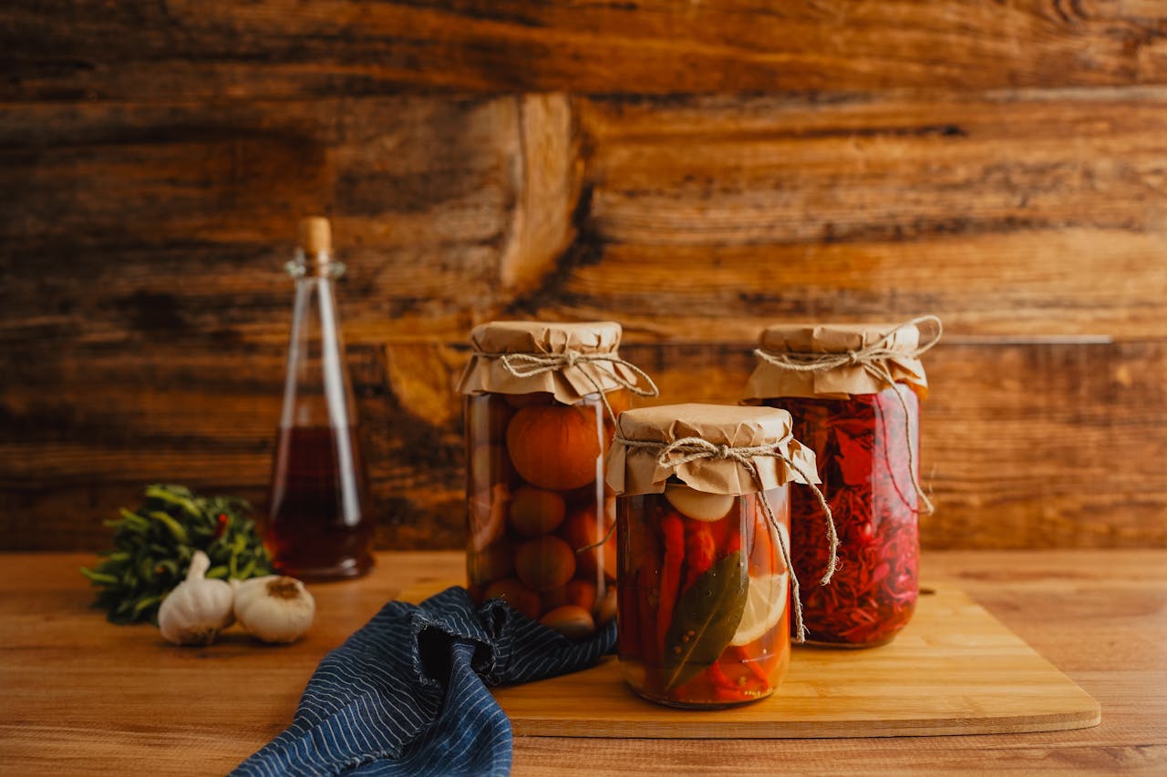 Rustic Kitchen Scene with Preserved Vegetables in Jars