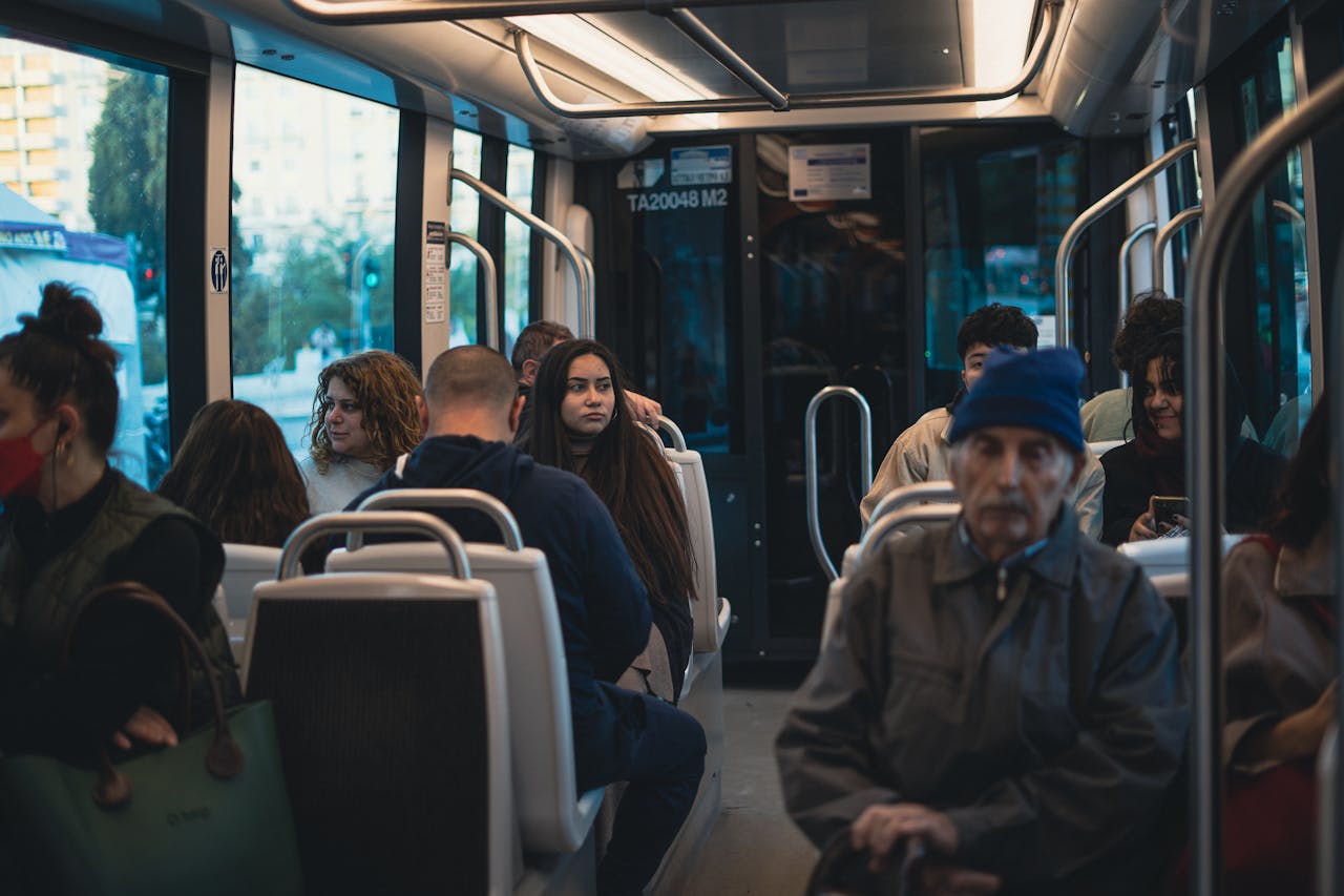 Commuters on a Busy Urban Bus Ride