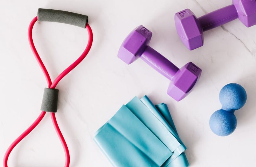 Set of fitness equipment placed on marble surface