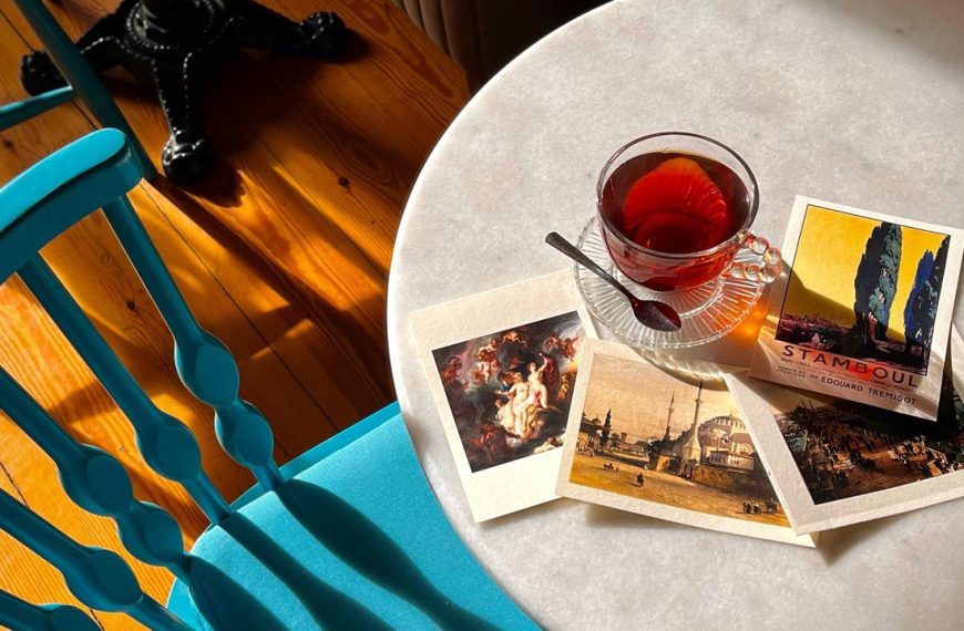 Cozy Cafe Table with Artistic Postcards