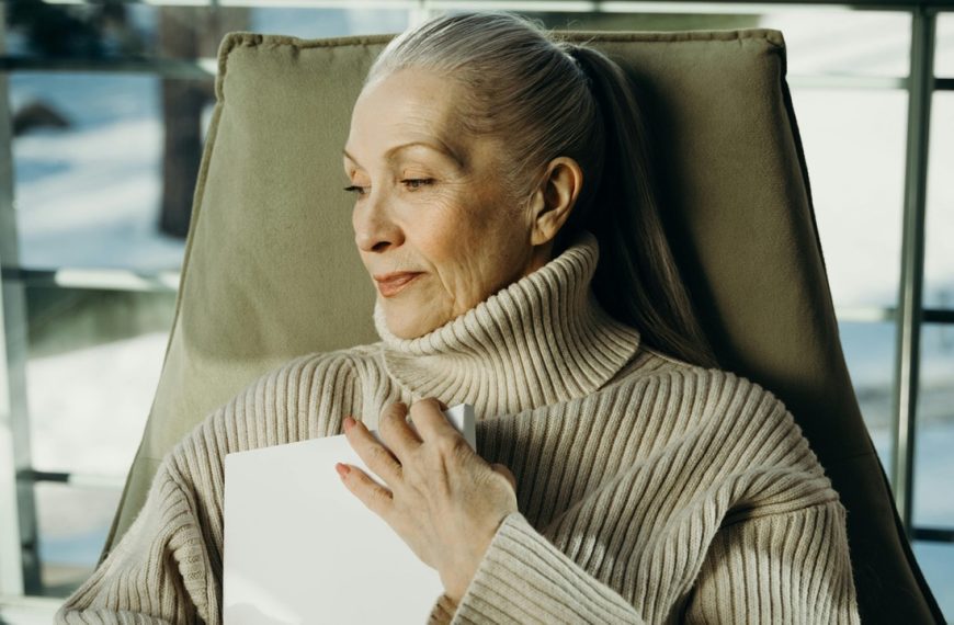 Woman hugging book, sentimental