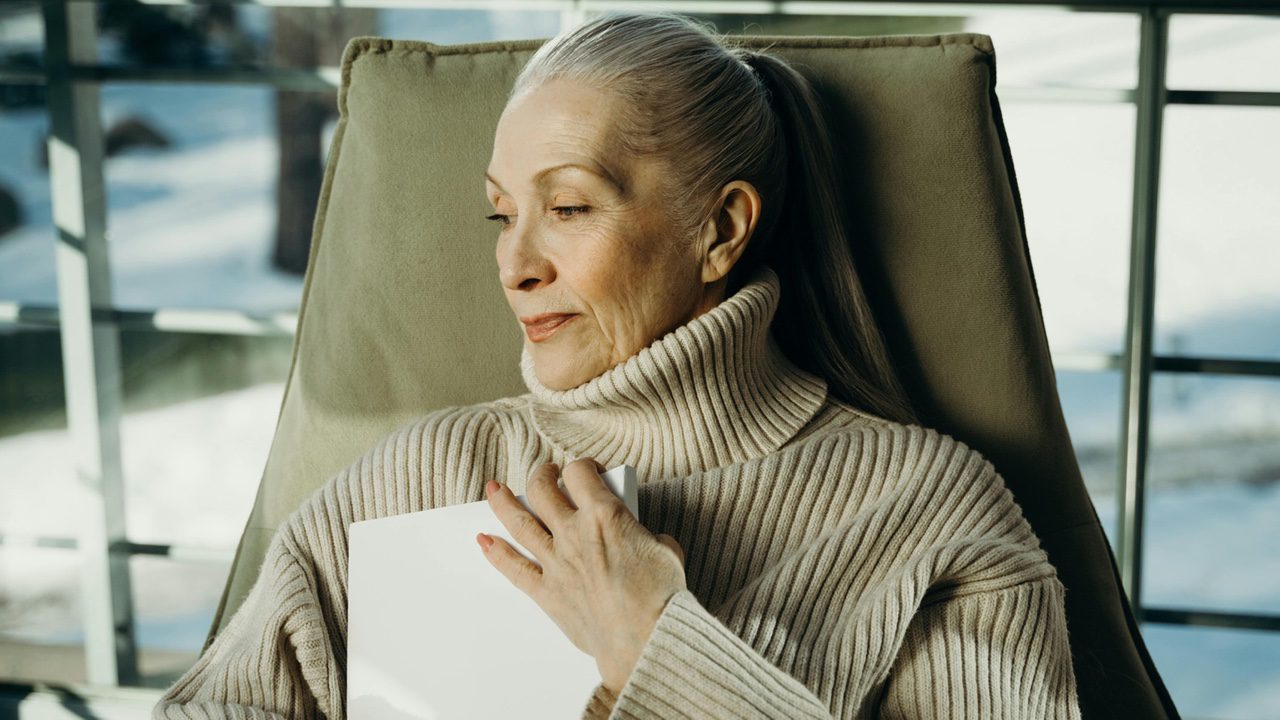 Woman hugging book, sentimental