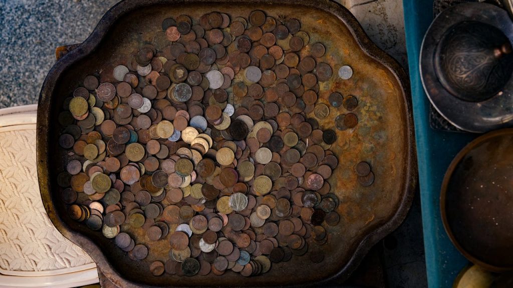 A tray filled with coins and other items