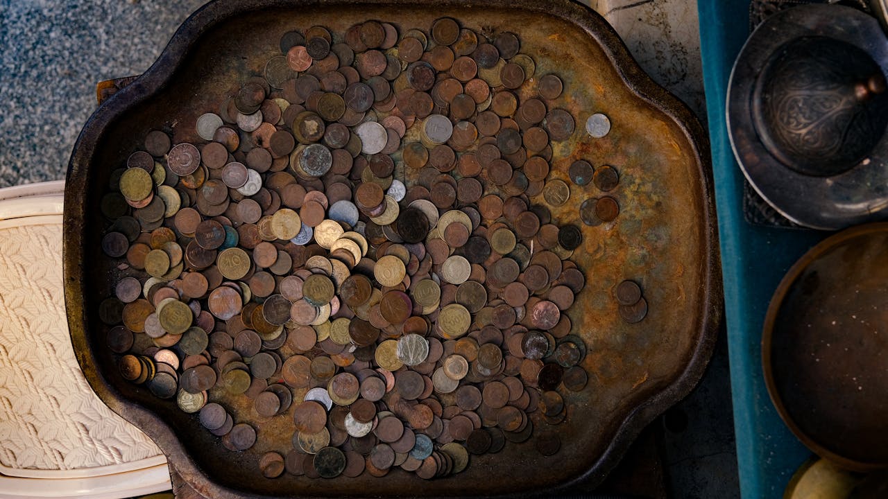A tray filled with coins and other items