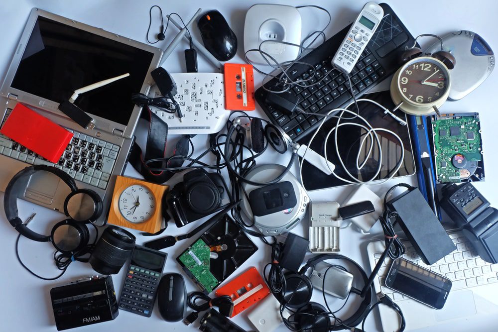 Pile of used Electronic Waste on white background, Reuse and Recycle concept, Top view