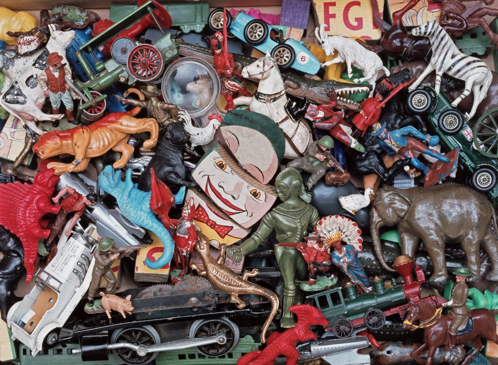 Collection of vintage toys from the 1950s and 1960s heaped together, medium close-up, viewed from above.