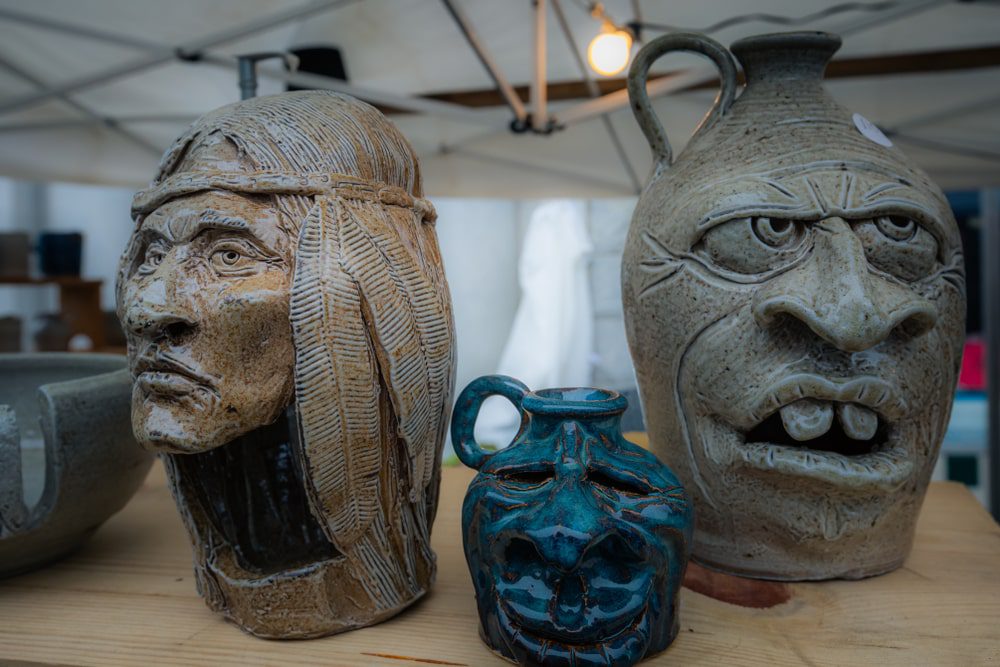 Scary face jugs at a Craft show in Mount Airy, North Carolina .