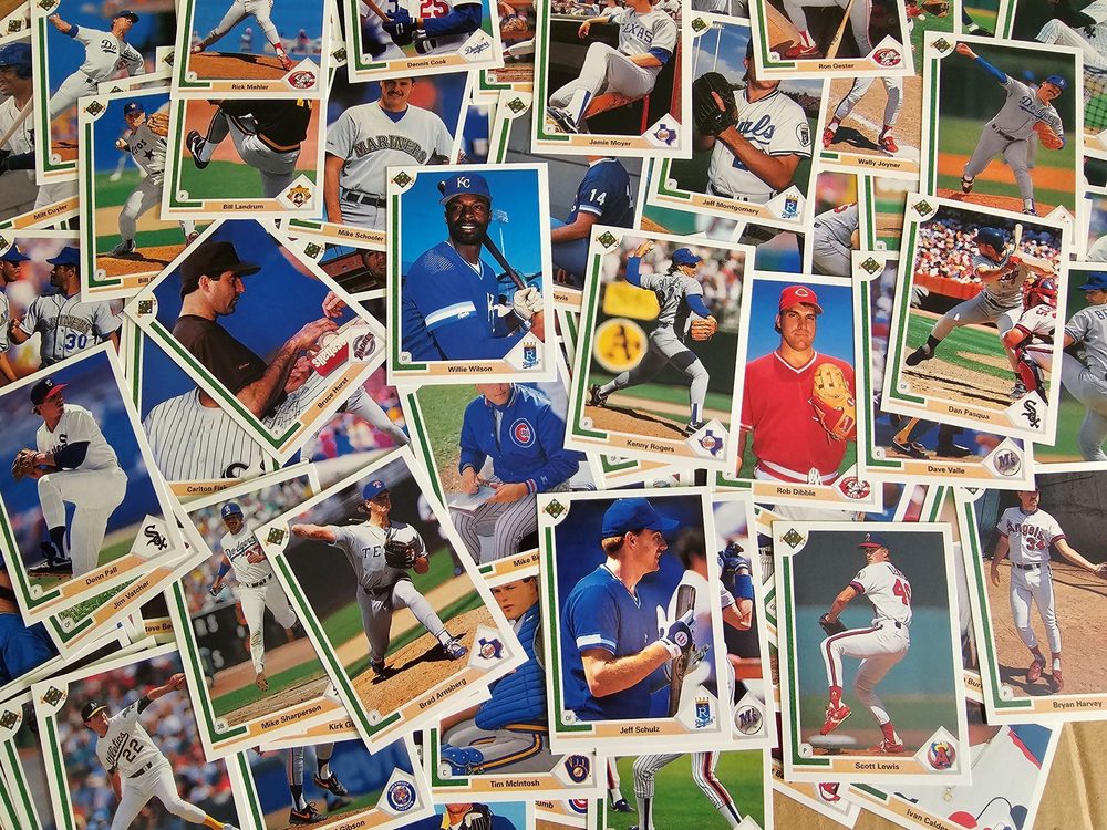 A top down view of a large assortment of baseball cards.