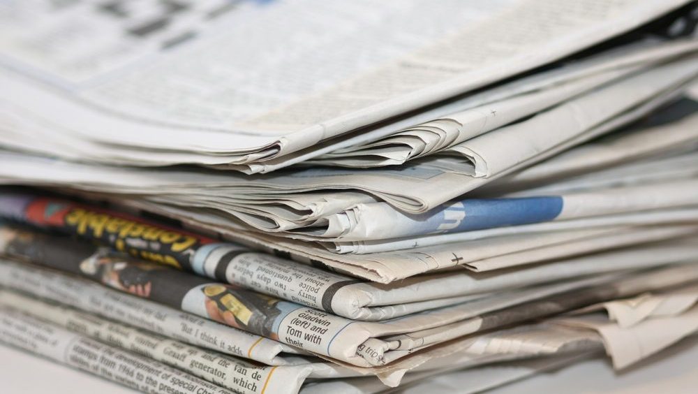 closeup image of a pile of newspaper