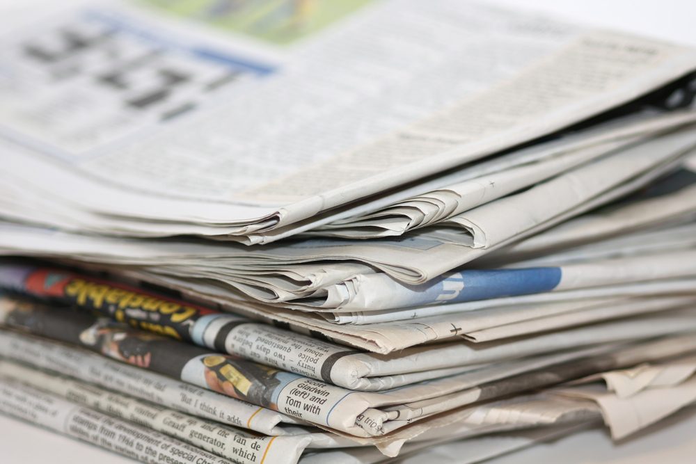 closeup image of a pile of newspaper
