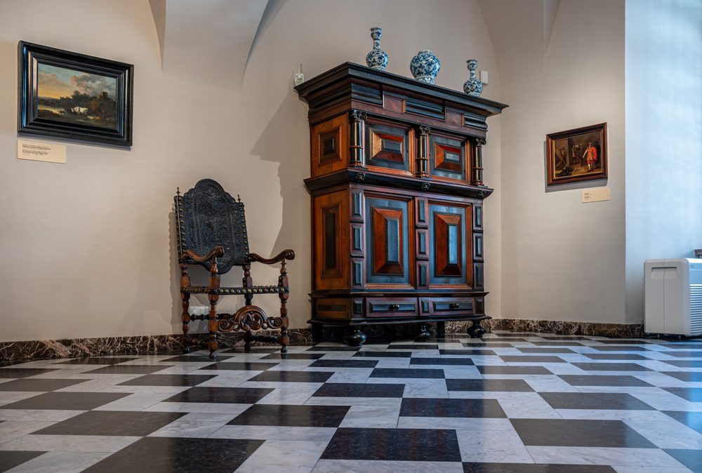 ntique furniture and patterned tiles at the interior of the Wawel castle