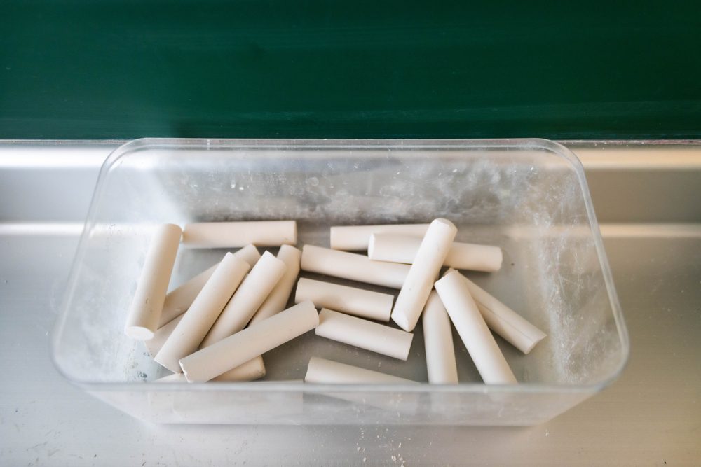 Container with White Chalk Sticks for Blackboards