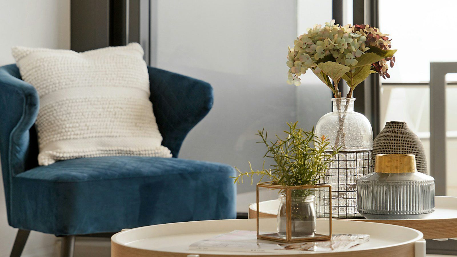 white flower on clear glass vase on white table
