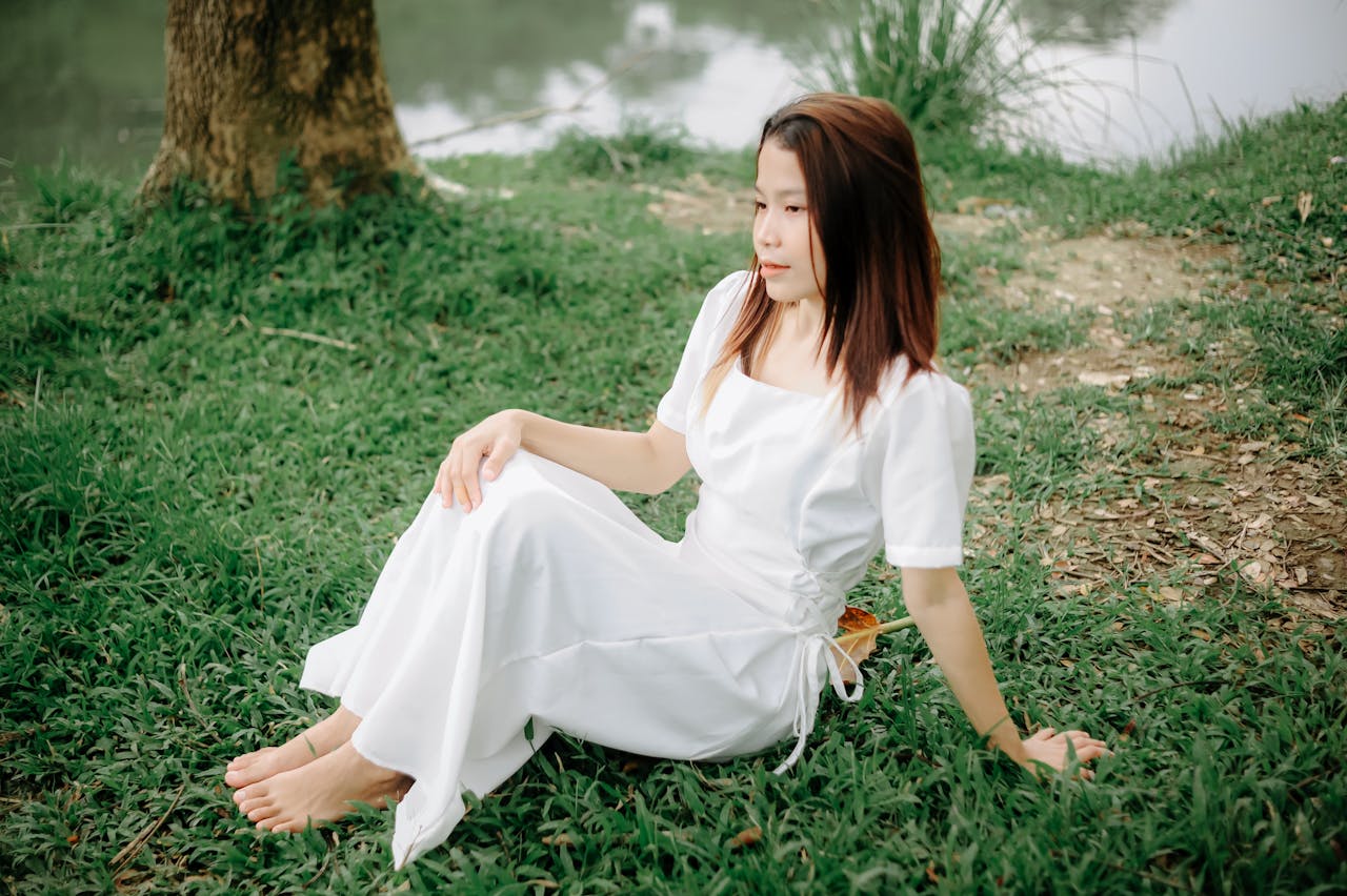 Woman Relaxing in a Green Park Setting