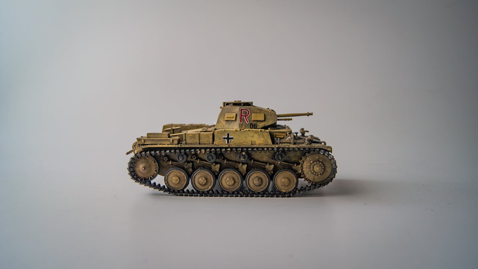 Detailed model of a World War II German tank displayed on a white background studio setup.