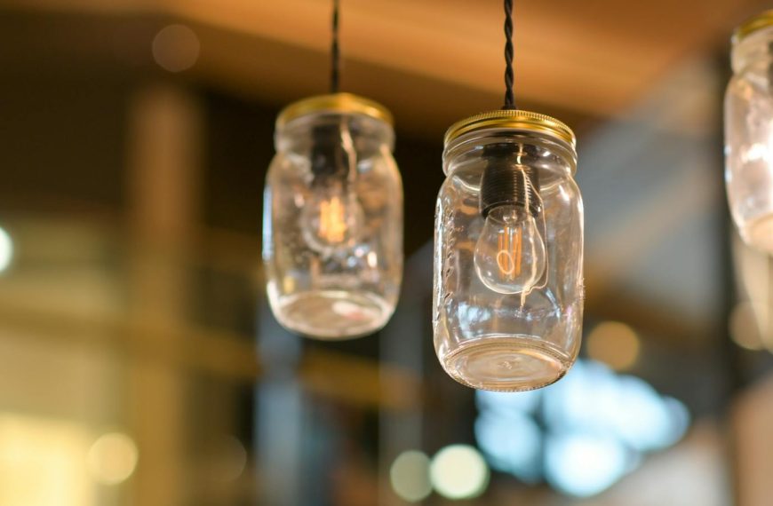 Stylish mason jar lights hanging indoors, creating a warm ambiance.